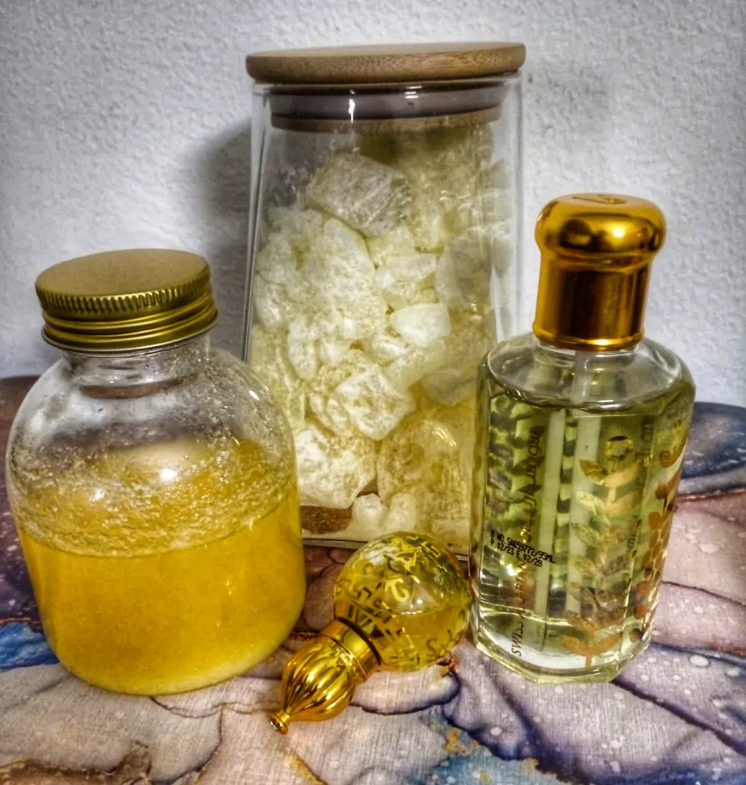 Raw bakhoor resin jar with perfume oil bottles